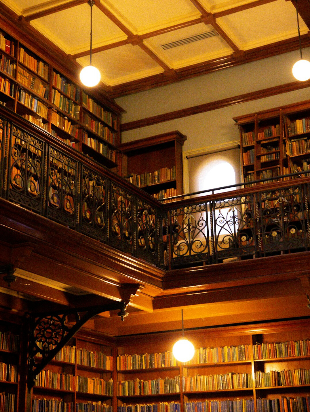 Old library reading room with tall shelves