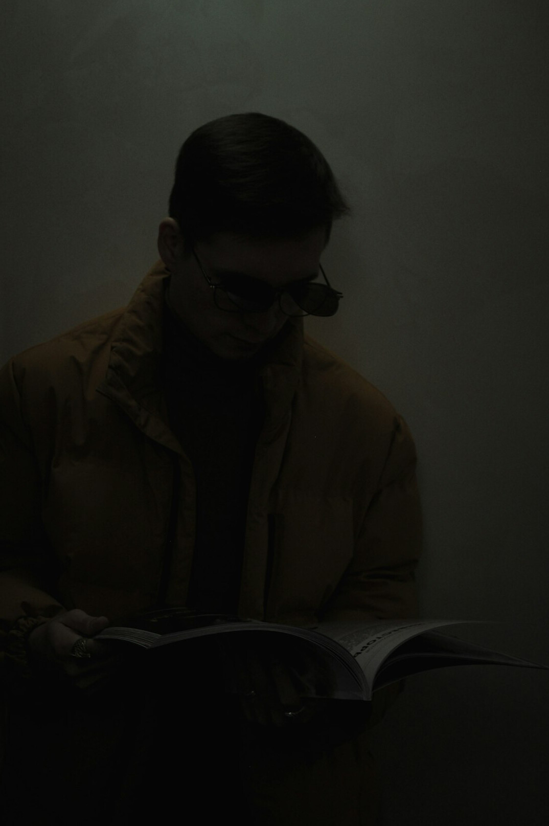 detective reading book at night