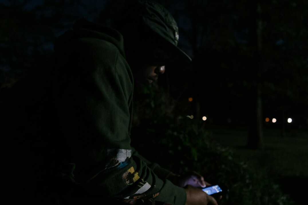 detective reading book at night