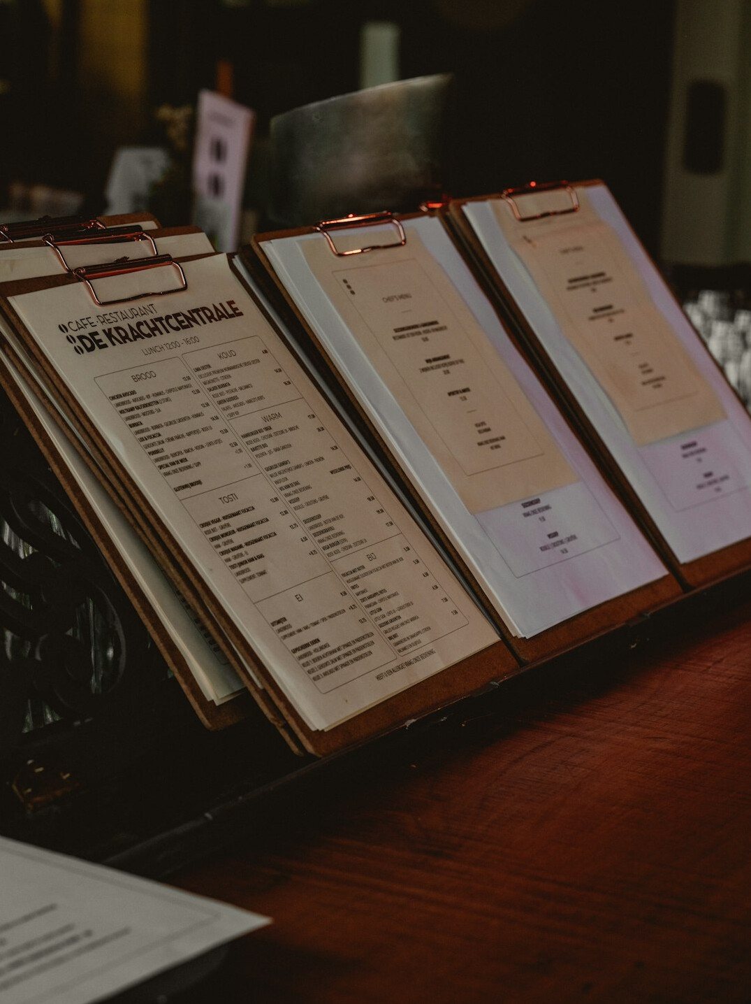 Paper documents and a pen on a wooden desk
